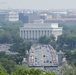 World War II era planes fly over Washington, D.C. seen from Arlington National Cemetery