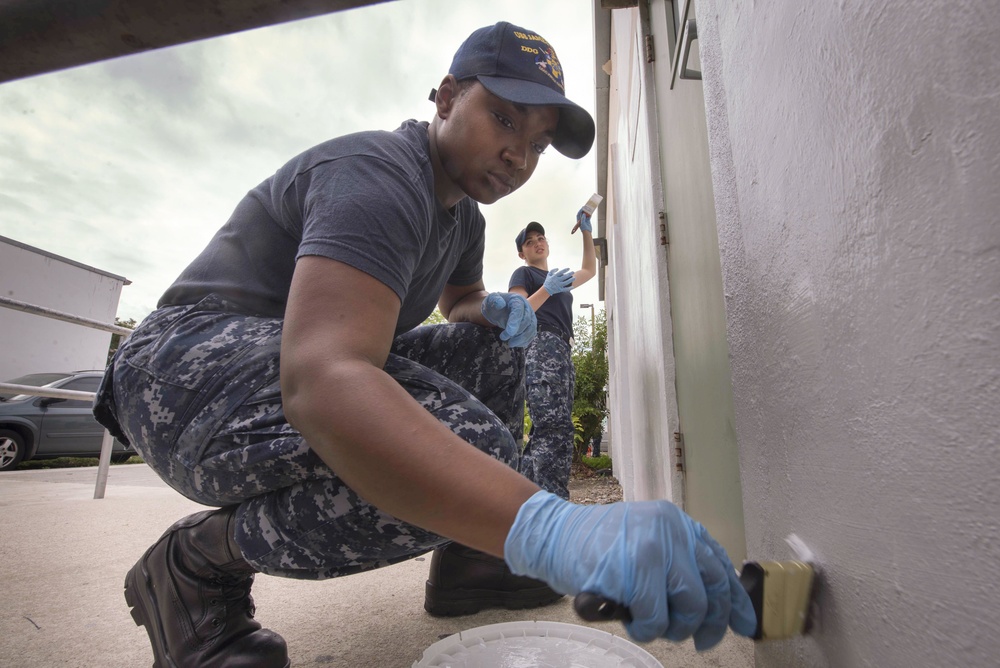 Sailors paint crisis center during Fleet Week Port Everglades