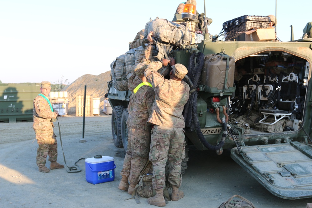 Soldiers load gear for Cav March