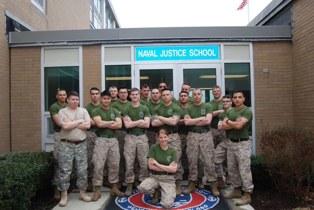 Soldier poses with Marine court reporter class