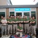 Soldier poses with Marine court reporter class