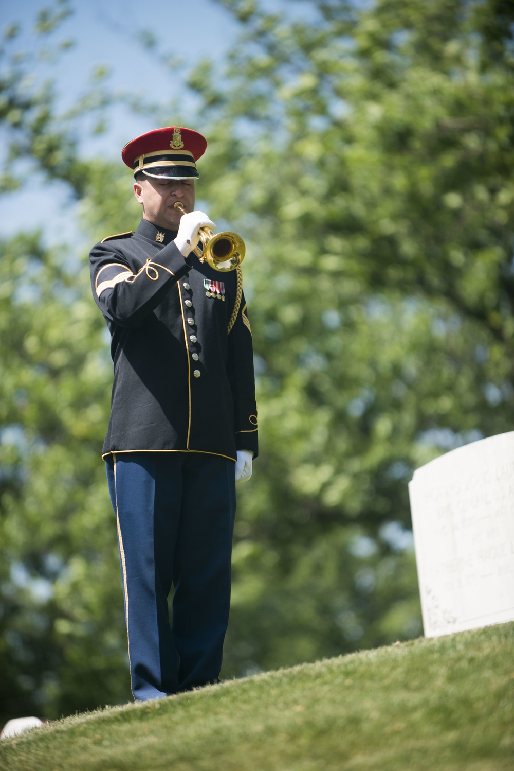 A ceremony honoring Hmong and Lao combat veterans at the memorial tree and plaque in Arlington National Cemetery