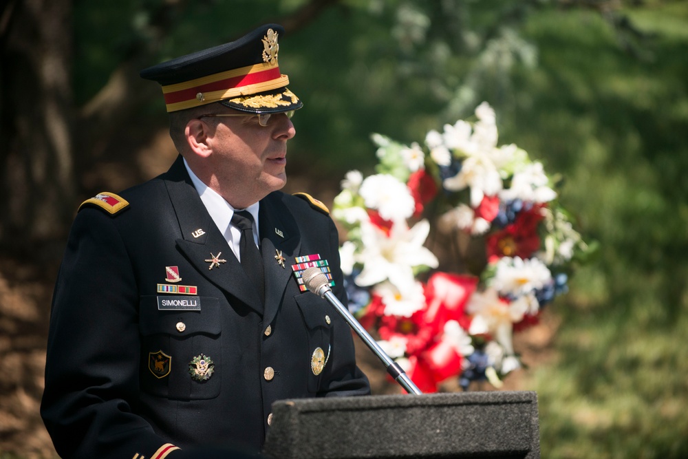 A ceremony honoring Hmong and Lao combat veterans at the memorial tree and plaque in Arlington National Cemetery