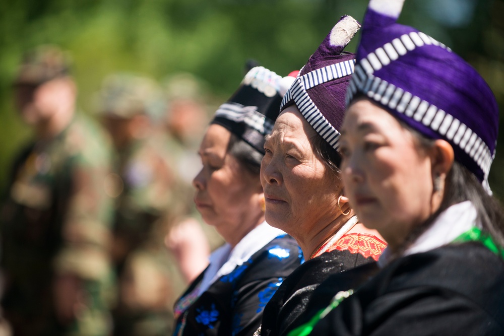 A ceremony honoring Hmong and Lao combat veterans at the memorial tree and plaque in Arlington National Cemetery