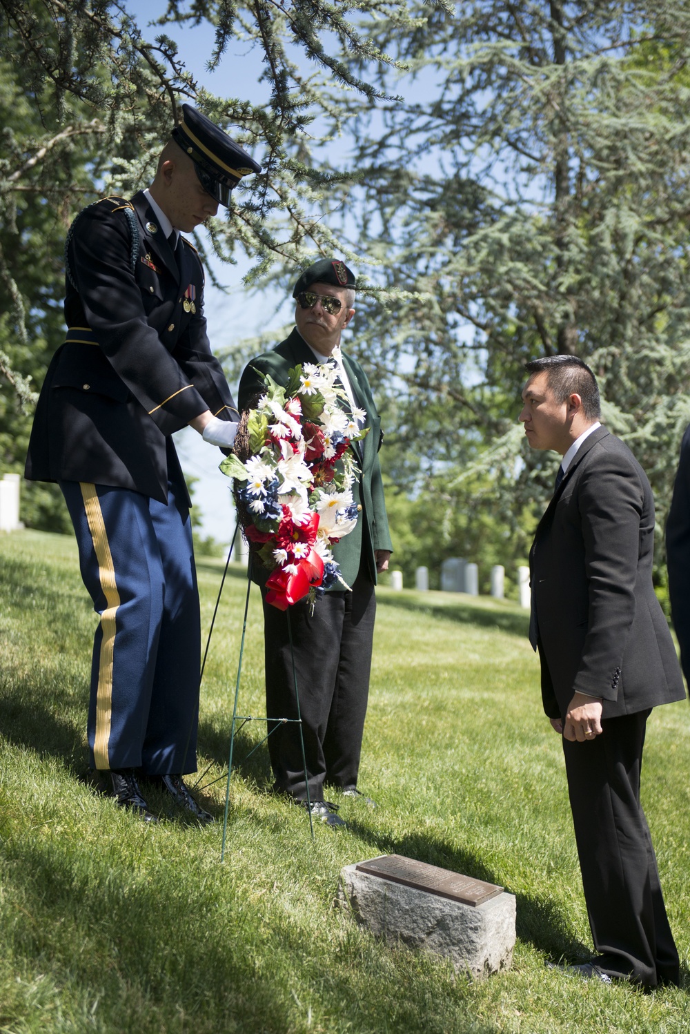 A ceremony honoring Hmong and Lao combat veterans at the memorial tree and plaque in Arlington National Cemetery