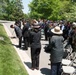 A ceremony honoring Hmong and Lao combat veterans at the memorial tree and plaque in Arlington National Cemetery