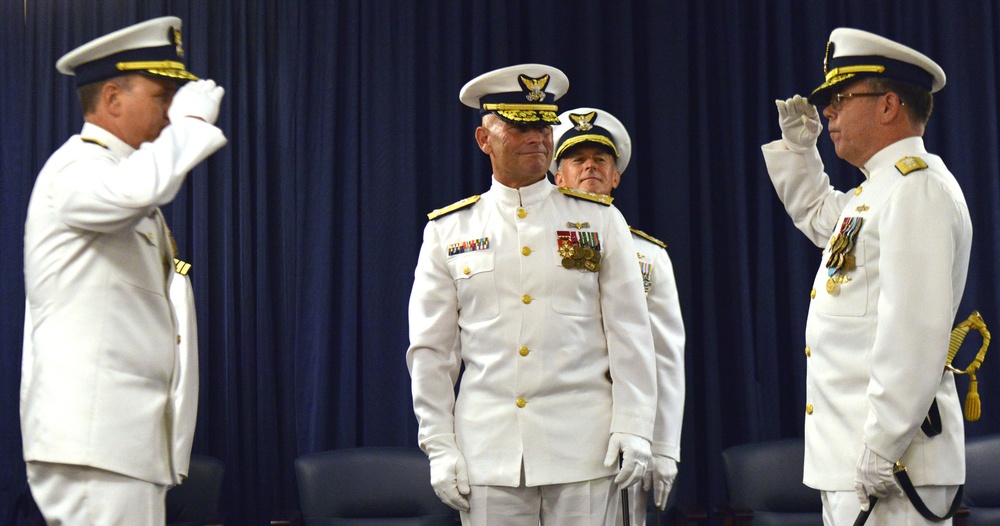 Rear Adm. Kevin Cook passes command