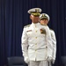 Rear Adm. Kevin Cook passes command