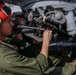 US Marines make sure helicopter's weapons are ready to fire at sea