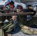 US Marines make sure helicopter's weapons are ready to fire at sea
