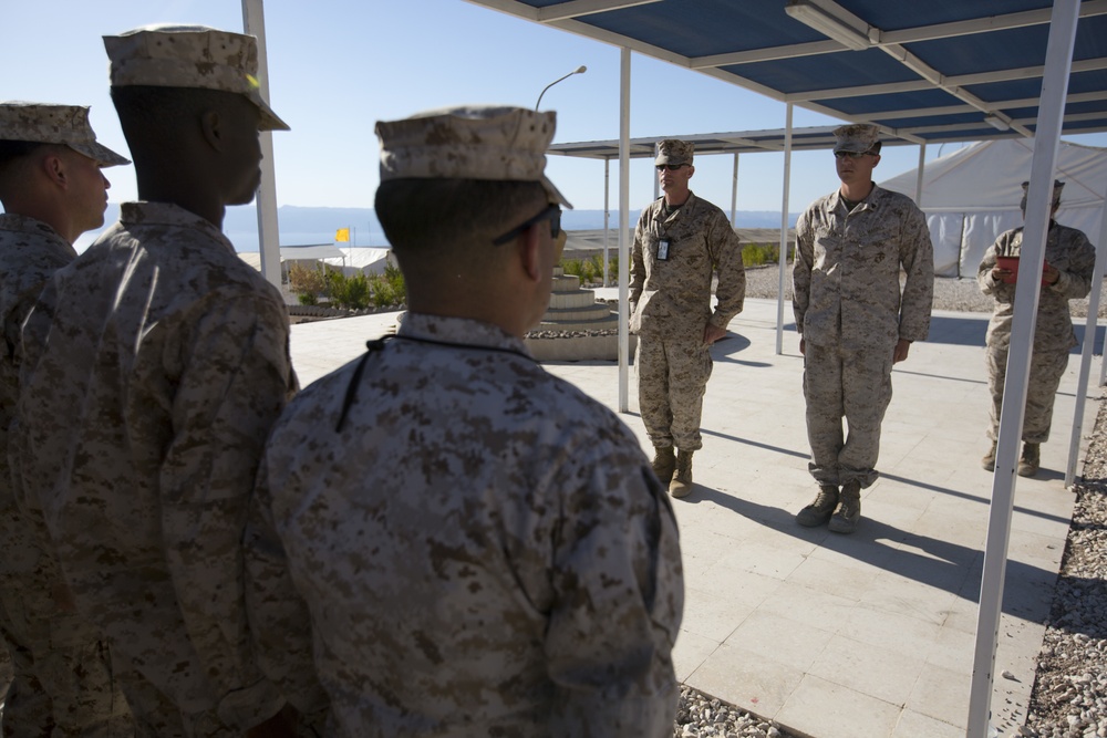 Marine receives diploma during multi-national exercise