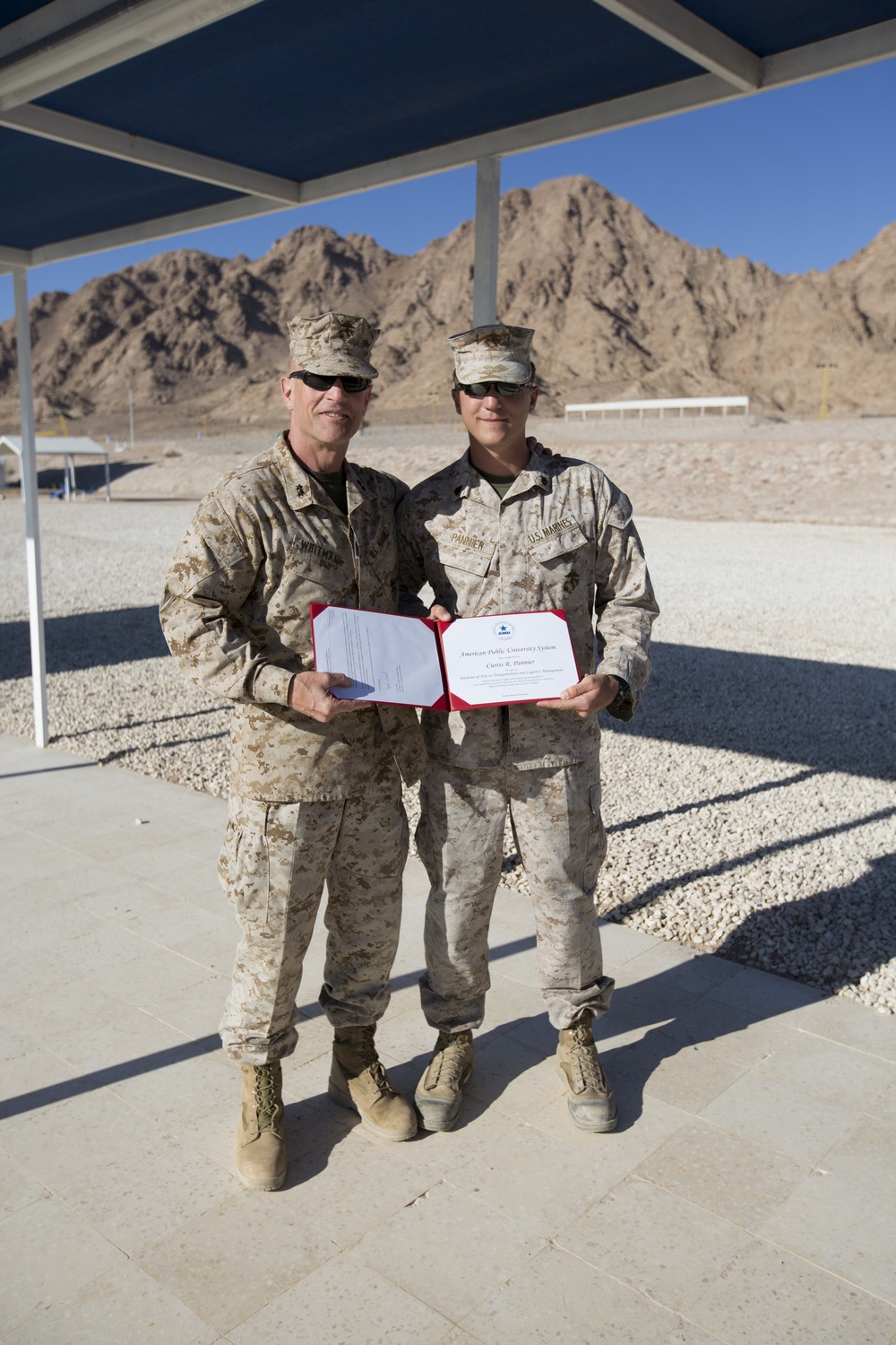 Marine receives diploma during multi-national exercise