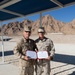 Marine receives diploma during multi-national exercise