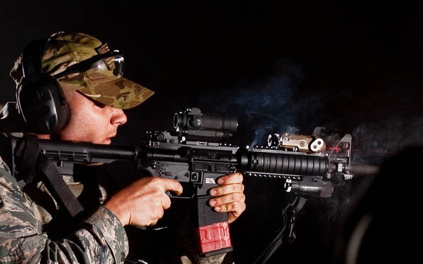 Aiming a PEQ-15 laser device on target