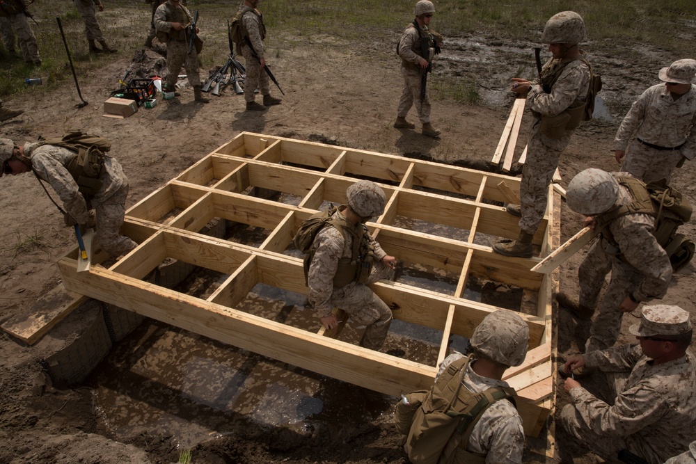 Built by hand: Marines with 8th ESB build a non-standard bridge