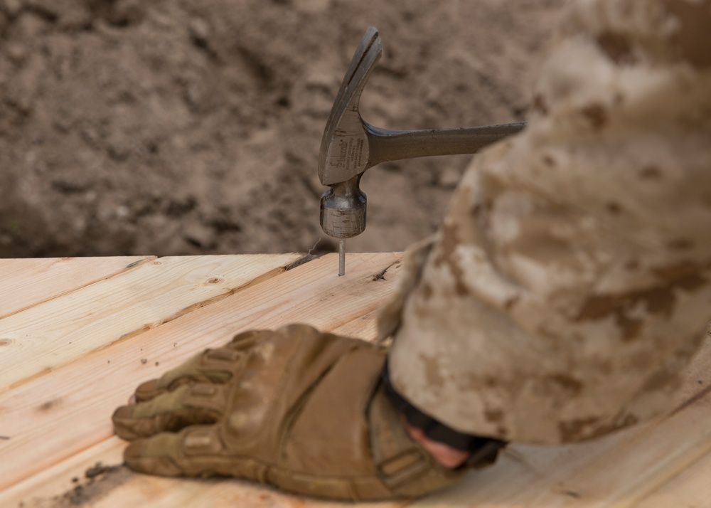 Built by hand: Marines with 8th ESB build a non-standard bridge