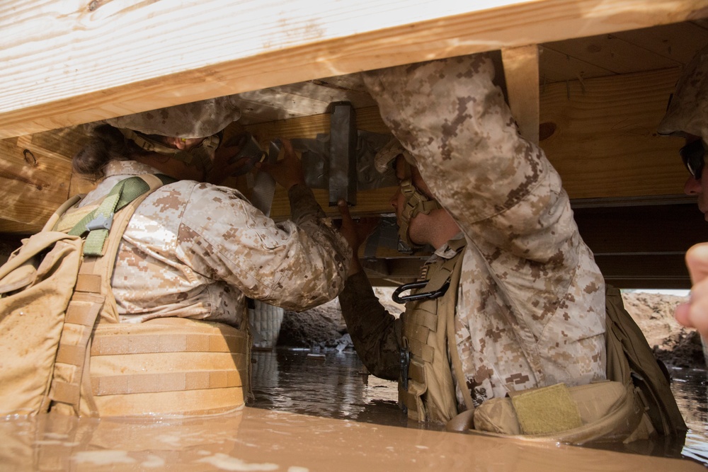 Built by hand: Marines with 8th ESB build a non-standard bridge