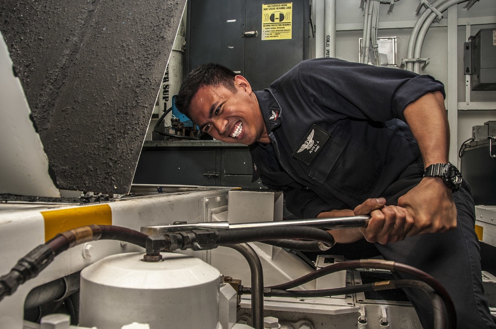 USS George Washington sailors perform maintenance