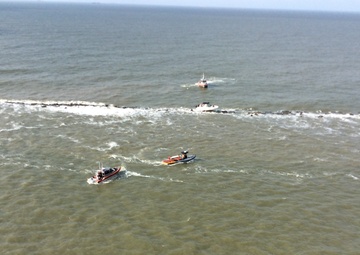 Coast Guard, Galveston Island Beach Patrol rescue 3 men off boat aground on Galveston Jetty