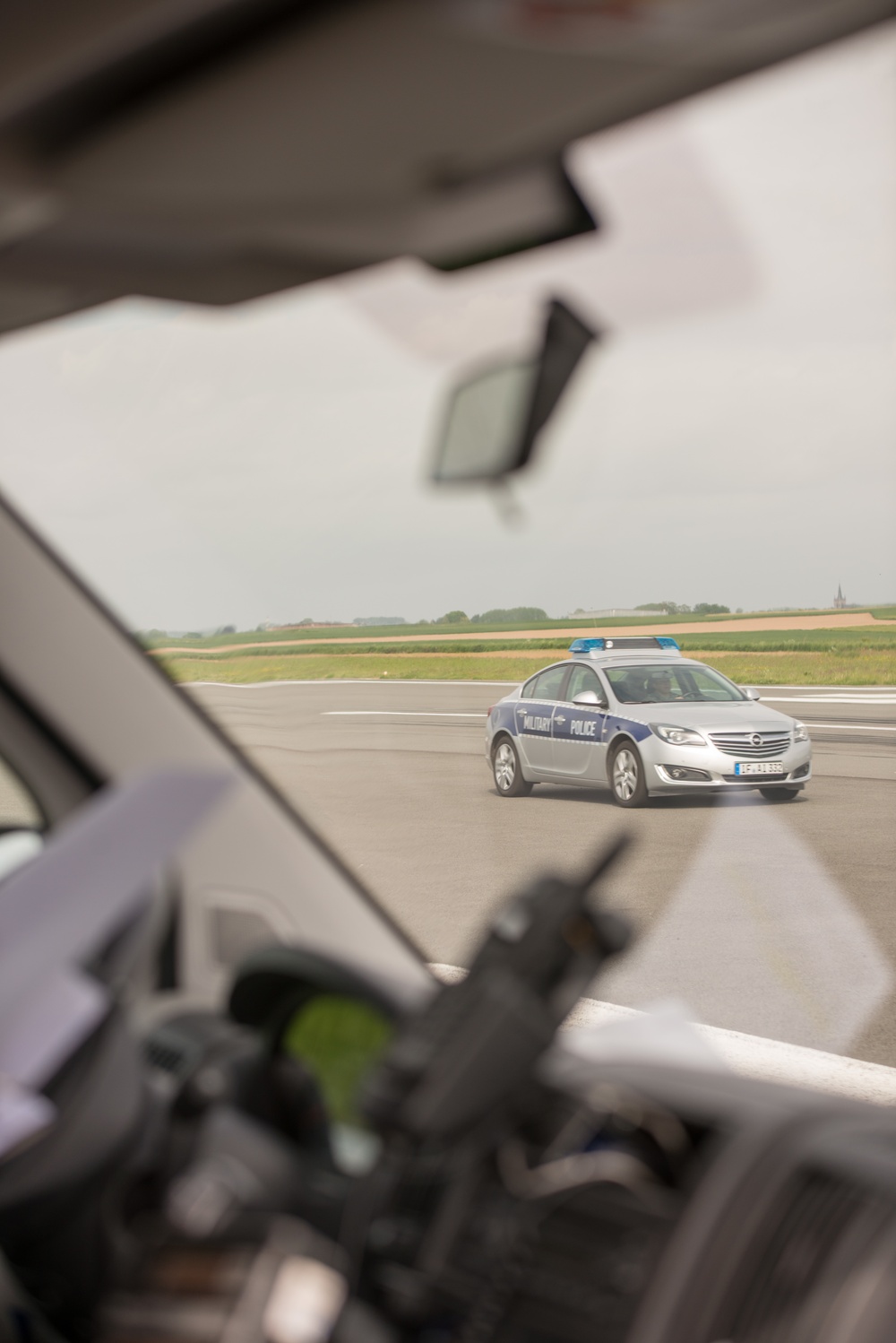 Belgian Police, US Military Police calibrate speedometers on Chièvres Air Base's airfield