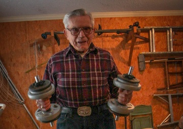 95 year-old WWII vet does curls in his garage