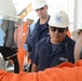 Coast Guard crew members conduct ship inspection