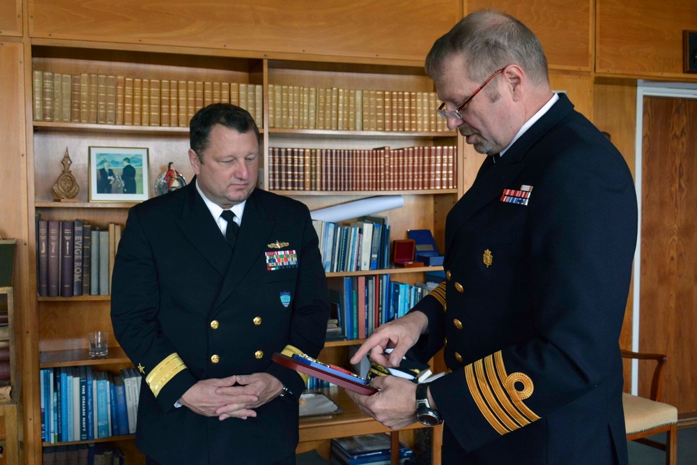 SNMG2 commander receives plaque from Danish naval captain