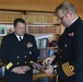 SNMG2 commander receives plaque from Danish naval captain