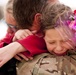 Deployed Airman embraces daughters