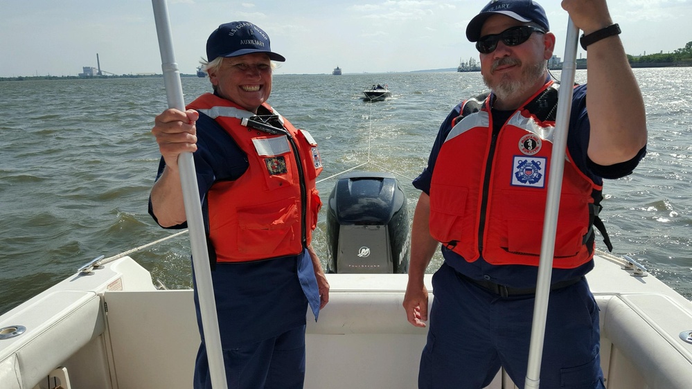 Auxiliary tows disabled boat