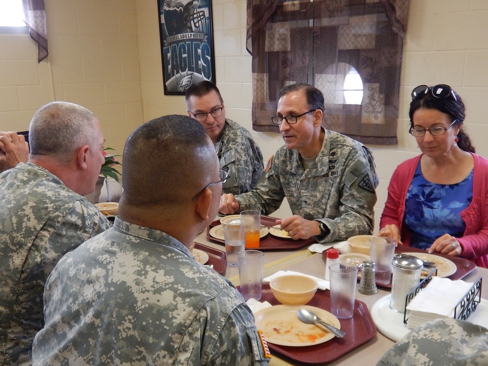 Brig. Gen. Daniel Dire and his wife Cynthia enjoy lunch with members of the 3rd Medical Command (Deployment Support), Detachment 11 (3d MCDS, Det. 11)