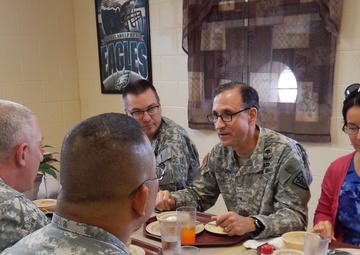 Brig. Gen. Daniel Dire and his wife Cynthia enjoy lunch with members of the 3rd Medical Command (Deployment Support), Detachment 11 (3d MCDS, Det. 11)