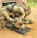 Soldiers assist casualty to litter