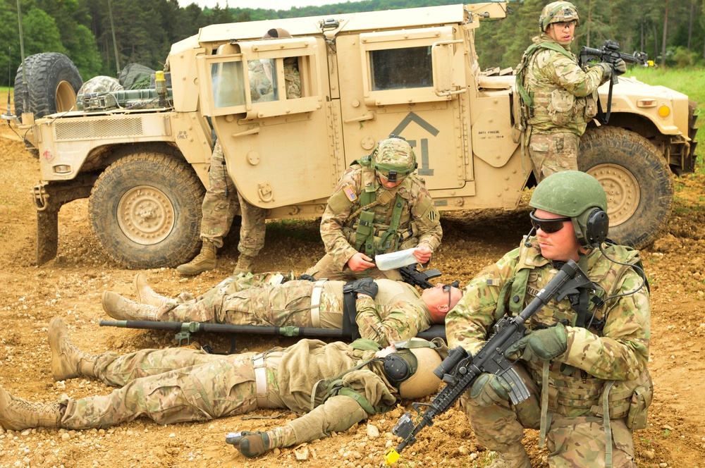 Combat medic renders aid during training exercise