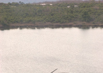 Army National Guard helicopter crews conduct water bucket training over Round Lake this afternoon, May 28