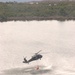 Army National Guard helicopter crews conduct water bucket training over Round Lake  this afternoon, May 28