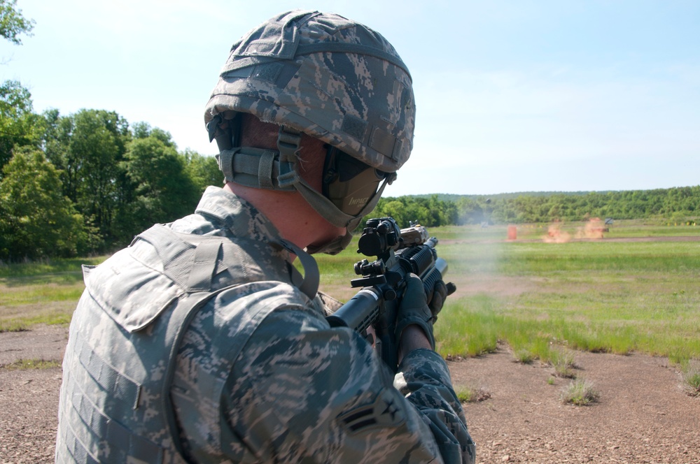Security Forces Squadron members train to use the M203 and the M249