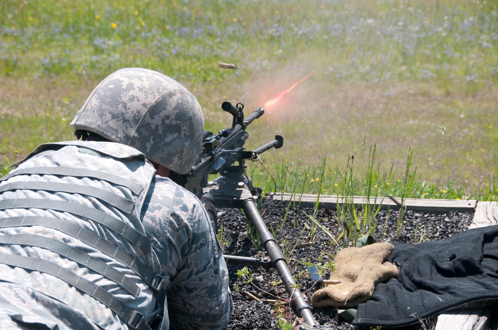 Security Forces Squadron members train to use the M203 and the M249