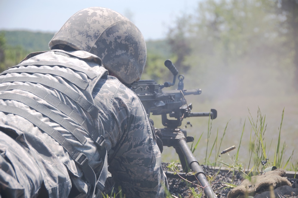 Security Forces Squadron members train to use the M203 and the M249