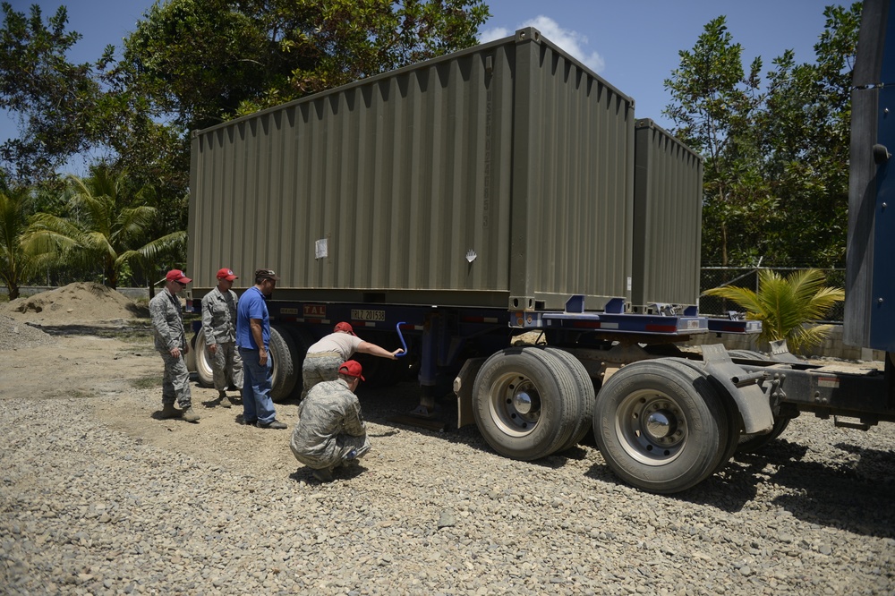 823rd Expeditionary RED HORSE Squadron moves equipment into place