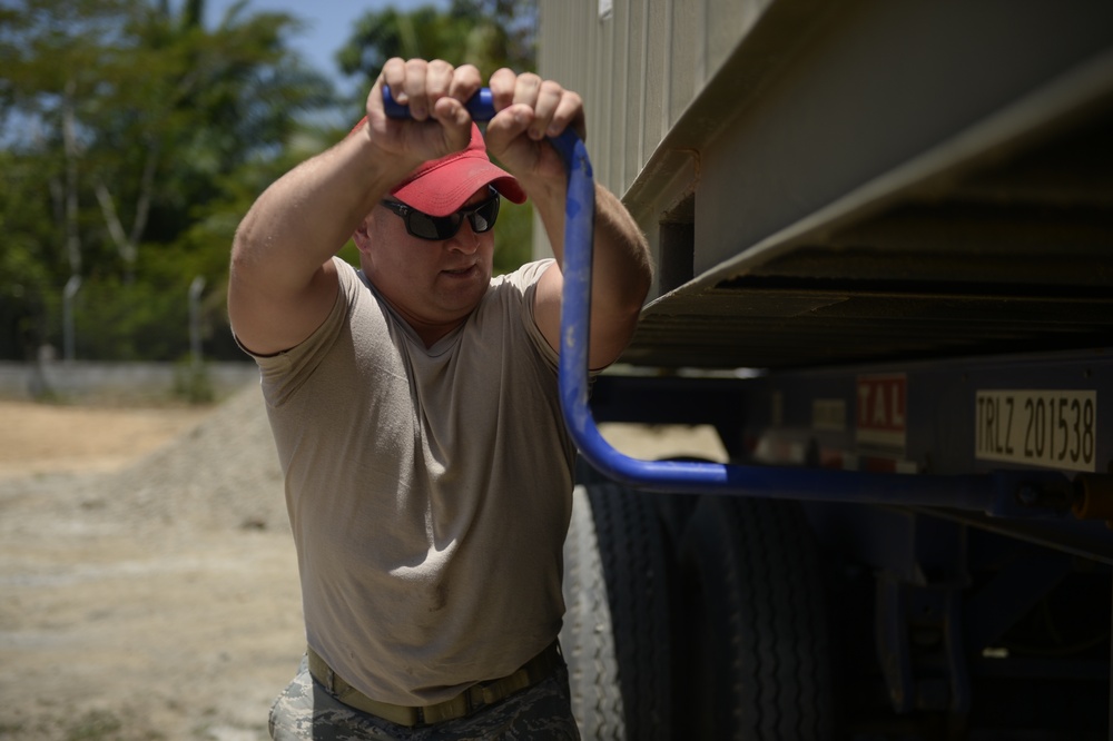 823rd Expeditionary RED HORSE Squadron moves equipment into place