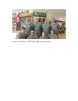 Soldiers of the 1194th help the mother of a fallen Soldier