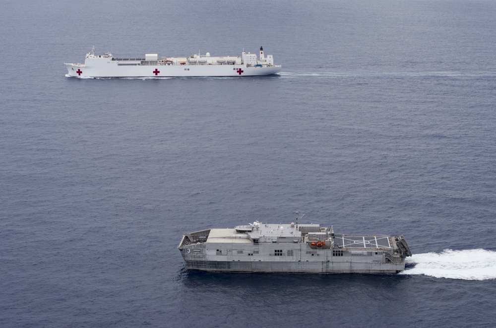 The Military Sealift Command hospital ship USNS Mercy (T-AH 19) and the Joint High Speed Vessel USNS Millinocket (JHSV 3) steam in formation during  Pacific Partnership 2015