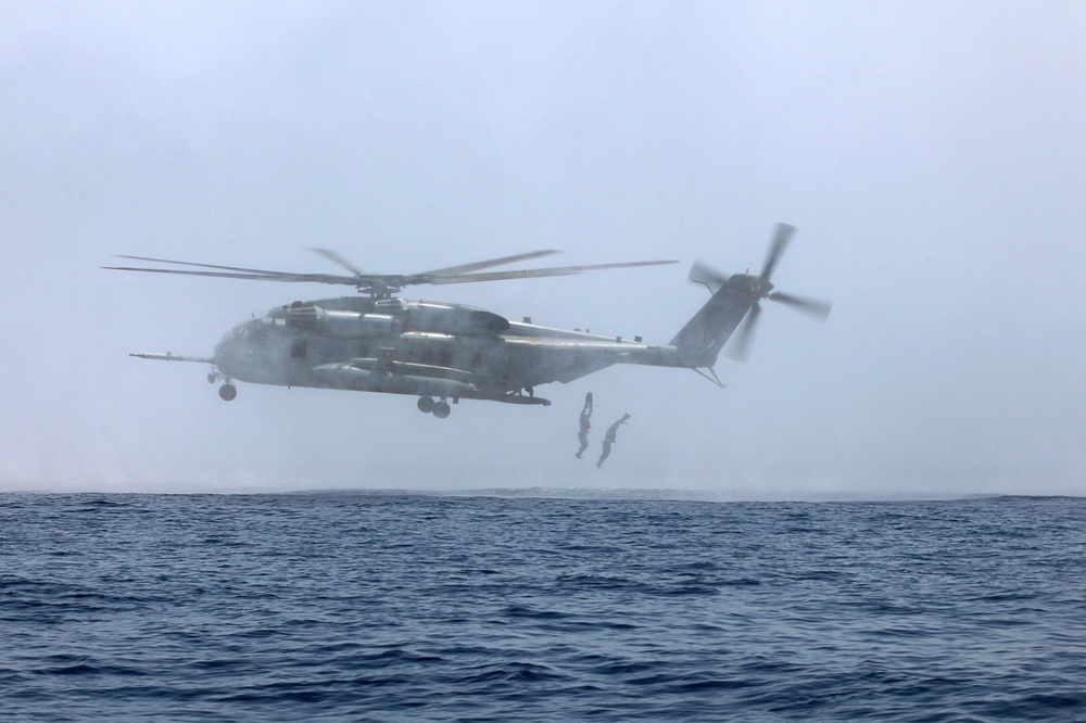 U.S. Marines go toe first from helicopters into the Gulf of Aden