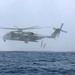 U.S. Marines go toe first from helicopters into the Gulf of Aden