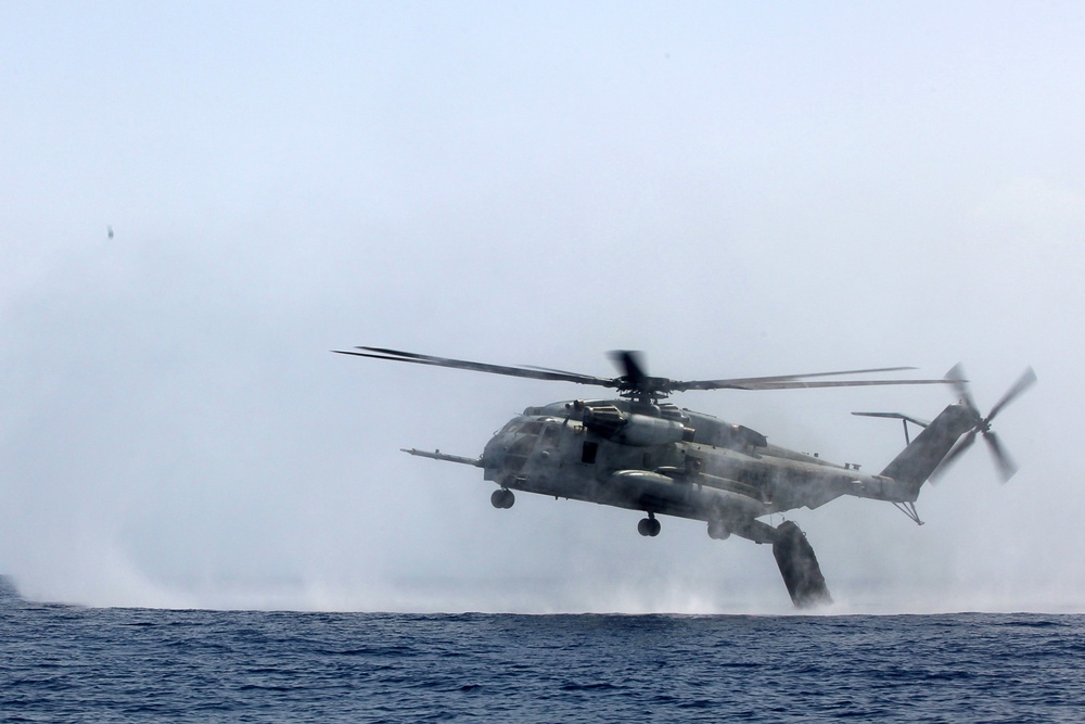 U.S. Marines go toe first from helicopters into the Gulf of Aden