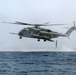 U.S. Marines go toe first from helicopters into the Gulf of Aden
