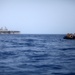 U.S. Marines go toe first from helicopters into the Gulf of Aden