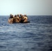 U.S. Marines go toe first from helicopters into the Gulf of Aden