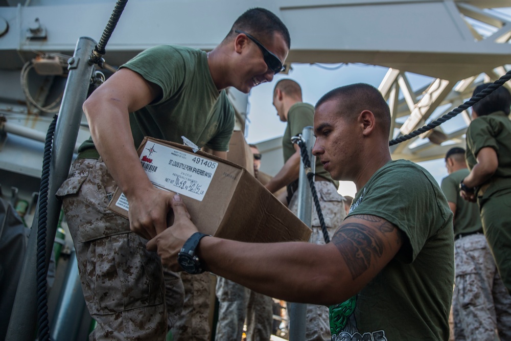 15th MEU Marines pitch in to replenish at sea